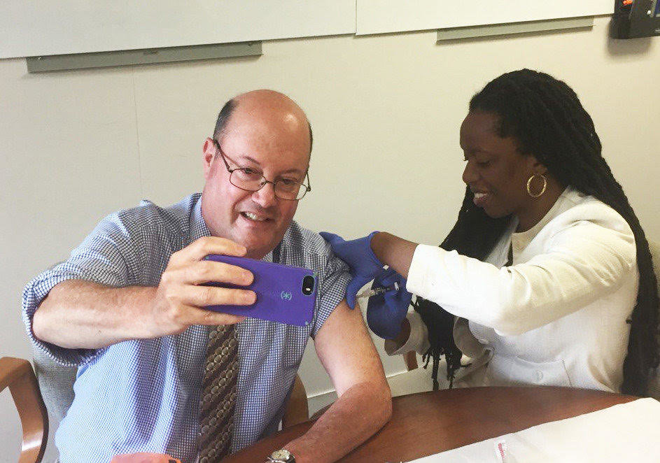 WPRO's Steve Klamkin receives a flu shot from Dr. Nicole Alexander-Scott.
